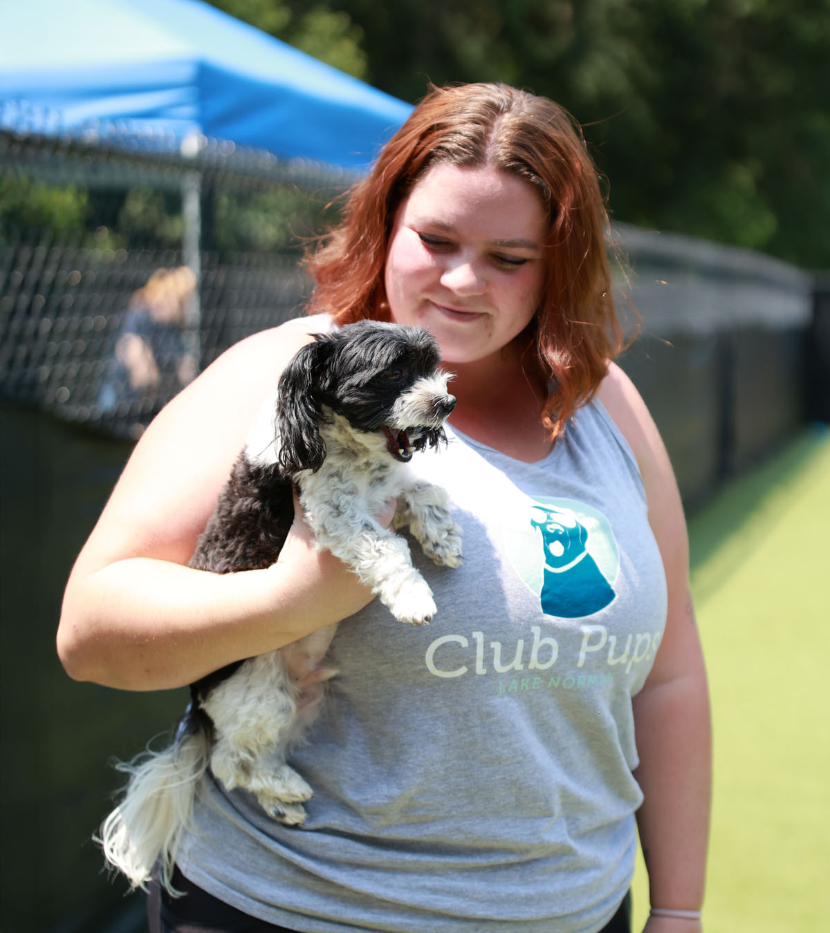 Club Pups staff with a pup